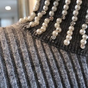 Gray sweater with faux pearl mock turtleneck.